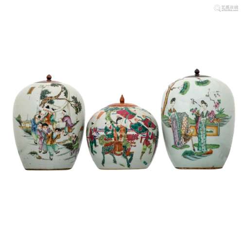 THREE CHINESE FAMILLE-ROSE FIGURES JARS AND COVERS