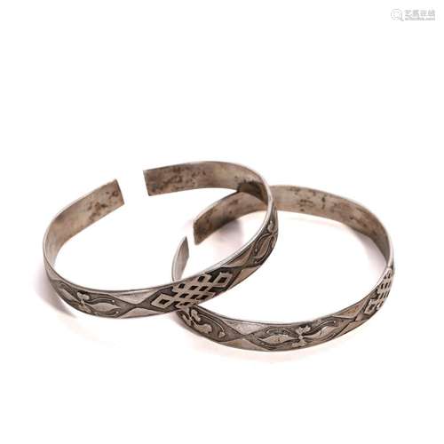 A PAIR OF SILVER BRACELETS