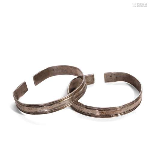 A PAIR OF SILVER BRACELETS