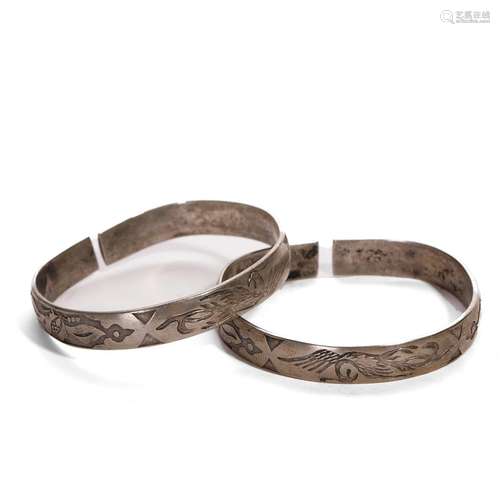 A PAIR OF SILVER BRACELETS