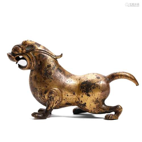 A GILT-BRONZE MYTHICAL BEAST