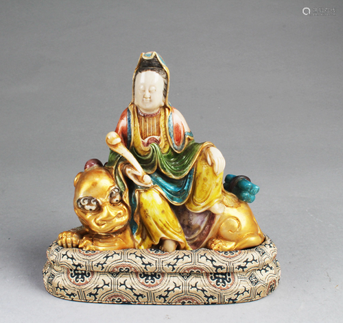 A Carved Polychrome Soapstone Guanyin Statue