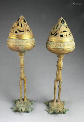 A Pair of Bronze Holders