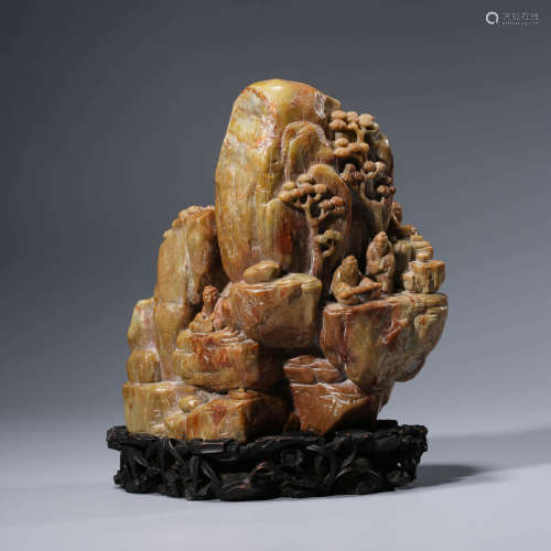 A CHINESE SOAPSTONE CARVING AND STAND