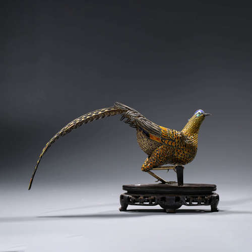 A CHINESE SILVER PHOENIX AND STAND