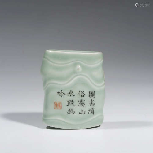 A CHINESE PORCELAIN CELADON-GLAZED POEM PAPER WEIGHT