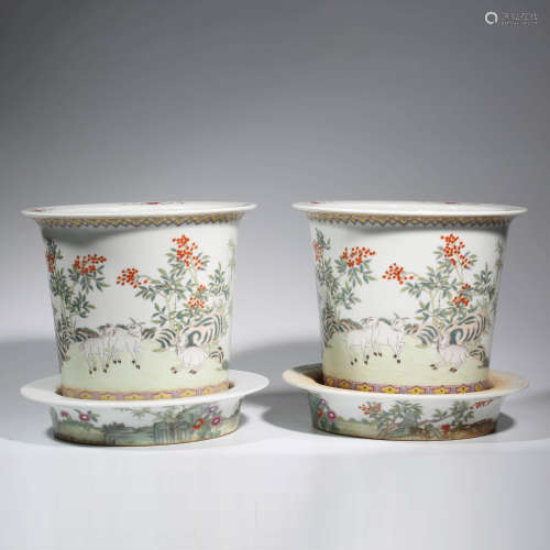 A PAIR OF CHINESE PORCELAIN FAMILLE ROSE RAM JARDINIERES