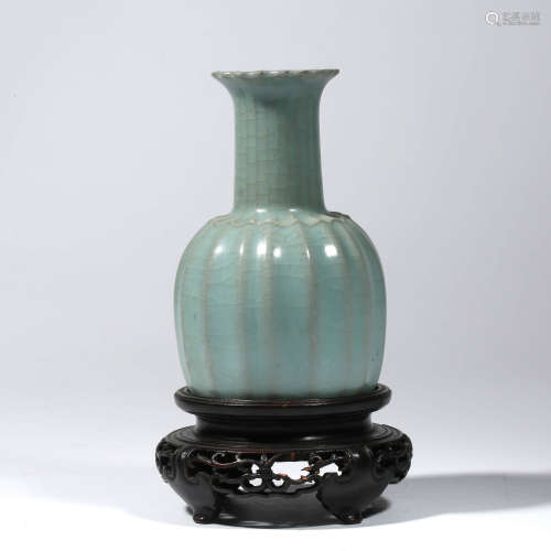 A CHINESE PORCELAIN LONG QUAN VASE AND STAND