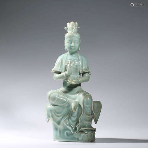 A CHINESE PORCELAIN CELADON-GLAZED AVALOKITESHVARA STATUE