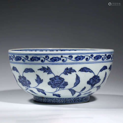 A CHINESE PORCELAIN BLUE AND WHITE INTERLOCKING BRANCHES BOW...