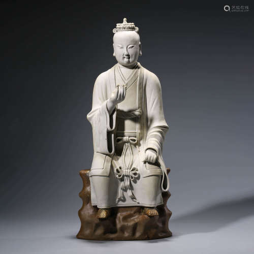 A CHINESE PORCELAIN WHITE-GLAZED SCHOLAR STATUE