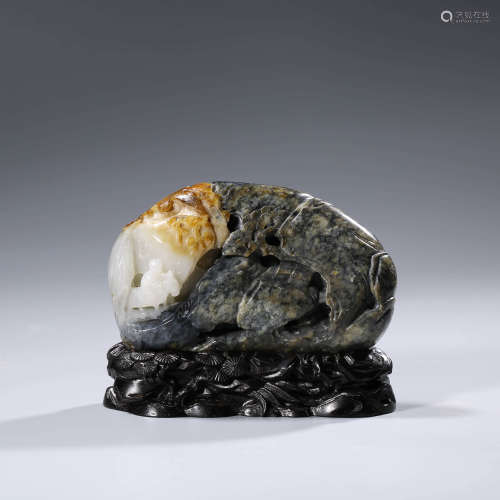 A CHINESE BLACK AND WHITE JADE PAPER WEIGHT AND STAND