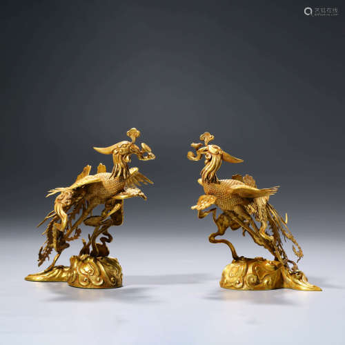 A PAIR OF CHINESE SIVLER GILDING PHOENIX