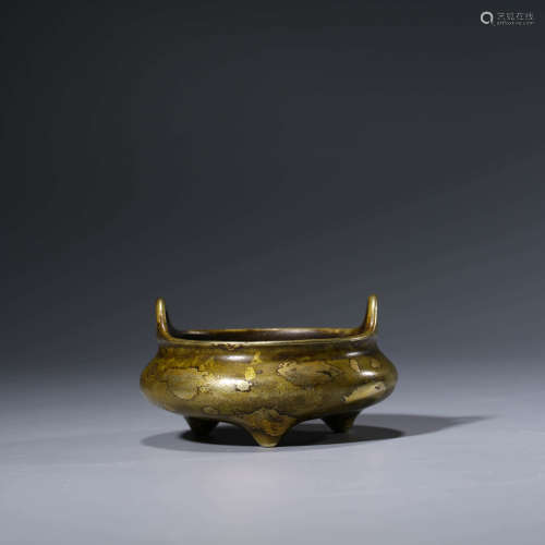 A CHINESE BRONZE GOLD SPASHED TRIPOD CENSER