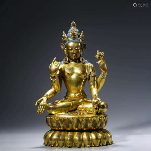 A CHINESE GILT-BRONZE FOUR-ARMED AVALOKITESHVARA STATUE