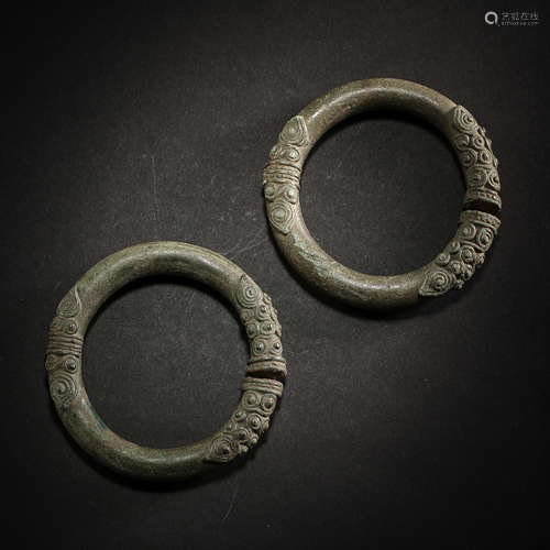 A PAIR OF OLD CHINESE BRONZE BRACELETS