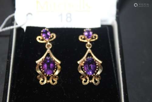 A pair of 9ct gold and amethyst pendant earrings of Art Nouv...
