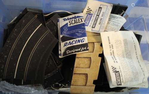 A box of scalextric track and accessories