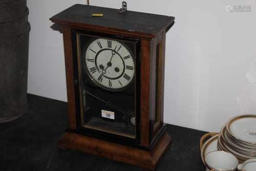 A late 19th century German walnut and ebonised cased mantle ...