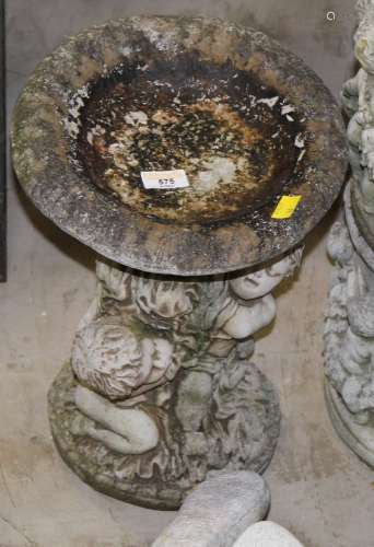 A cast composite stone garden bird bath of circular dish for...