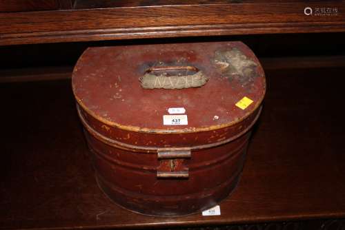 A 19th century red painted metal oval hat box (with scuffing...