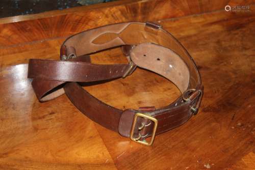 A brown leather military dress belt