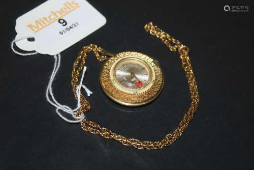 A vintage timeroy gilt metal and enamelled circular pendant ...