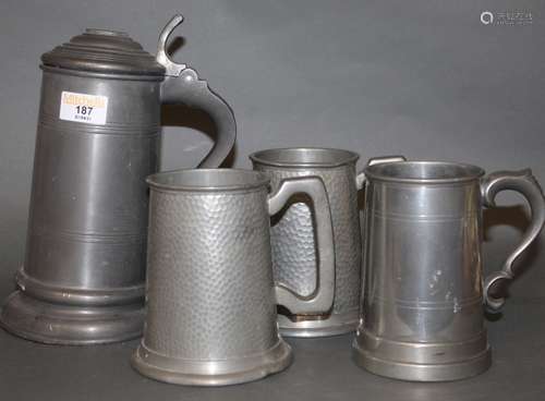 A Haugiud of Norway pewter lidded tankard, 23 cm high (dente...