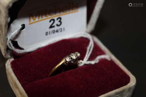 A 9ct gold three stone diamond engagement ring, the shank of...