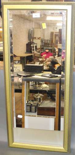 A modern oblong gilt framed and bevelled wall mirror, 84 cm ...