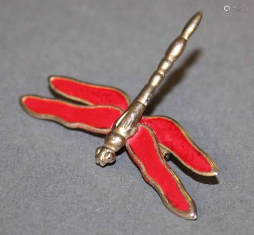 A red enamelled gilt metal dragon fly pattern brooch, 3.