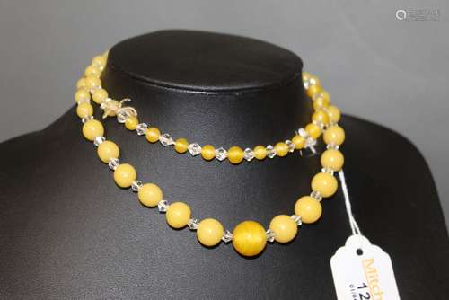 A vintage crystal and yellow agate graduated bead necklace,