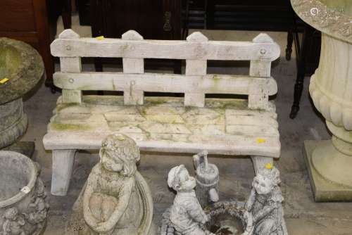 A cast composite stone child's size garden bench,
