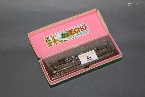 A vintage Hohner Echo Harp harmonica, cased.