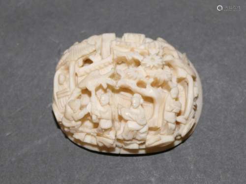 A pre 1947 Chinese or Cantonese carved ivory oval cabochon,