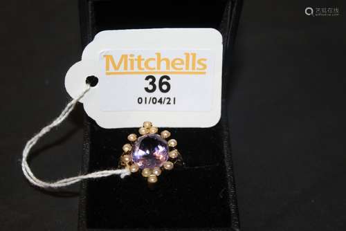 A coloured metal amethyst and seed pearl ring of Victorian d...