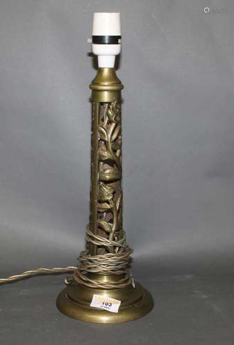 An early 20th century pierced brass electric table lamp base...