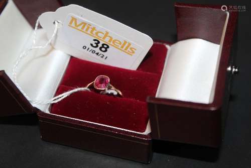 A 9ct gold and deep pink stone (possibly Ruby),