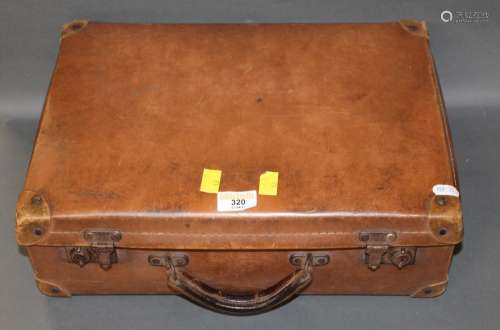 A small chestnut brown stitched leather suitcase. 40 cm x 30...