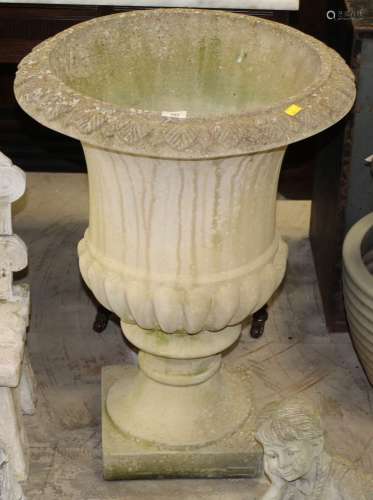 A cast composite stone campana style urn,