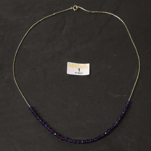 A silver and faceted amethyst bead necklace, by Jennie Fergu...