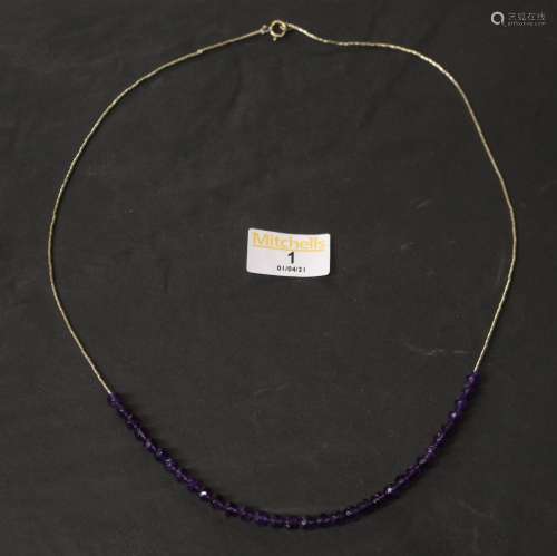 A silver and faceted amethyst bead necklace, by Jennie Fergu...
