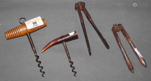 Two old cork screws and two pairs of nut crackers