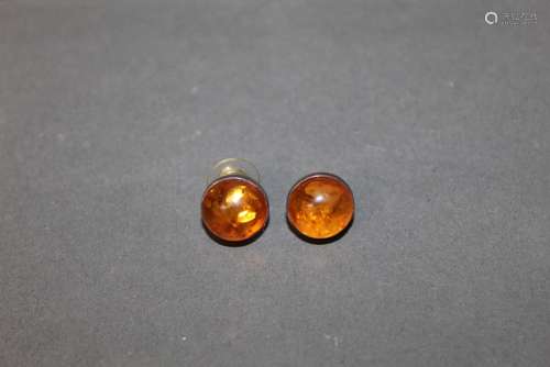 A pair of silver and cabochon amber circular earrings