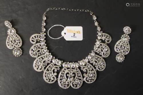 A white metal and paste wedding jewellery suite comprising n...