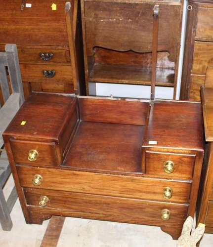 A 1930's dark oak dressing chest of Art Deco design with arc...