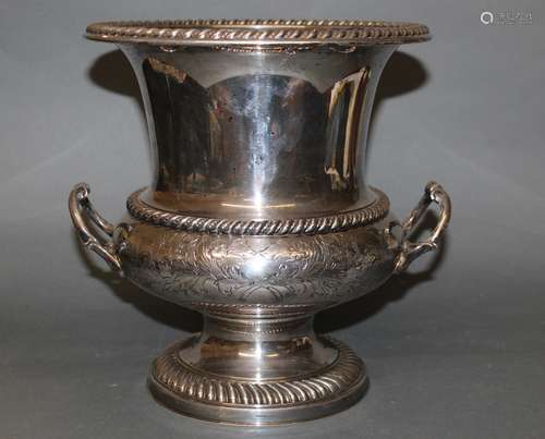 A silver plated champagne bucket of Campana urn form, the bo...