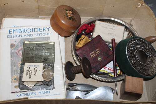 A tin containing a selection of silver plated watch chain cl...