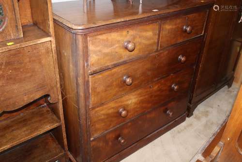 A Victorian mahogany chest of drawers with rounded front cor...