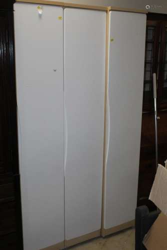 Three white and beech effect wardrobes each 36 cm wide